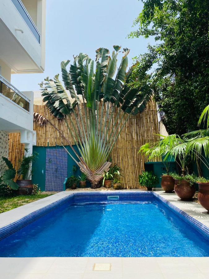 L'Oasis Guesthouse 코토누 외부 사진